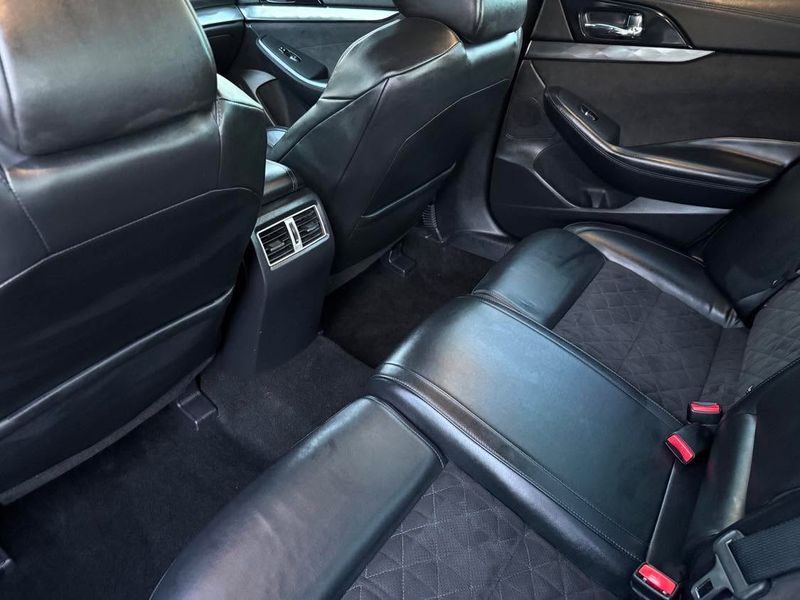 Rear seats vacuumed and shampooed during a Hartford, WI auto detail