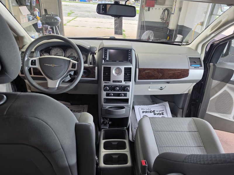 Chrysler minivan dashboard and steering wheel after a full interior detail in Hartford, WI