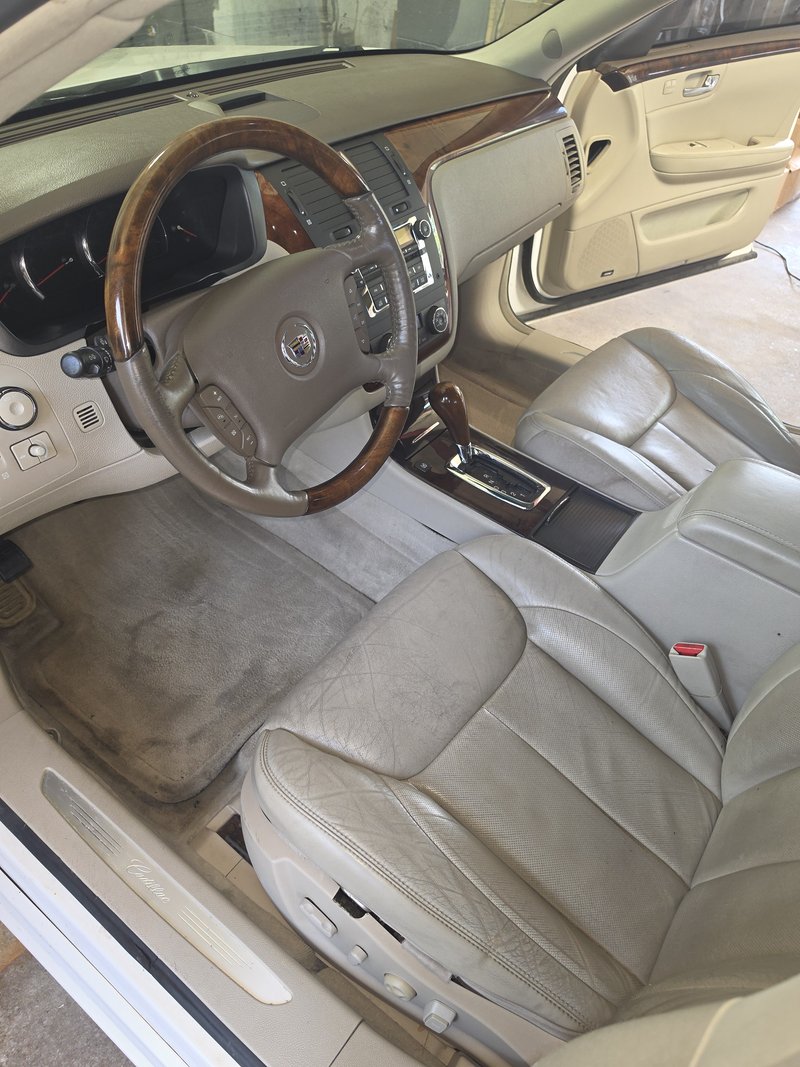 Driver area of an older luxury sedan cleaned by Sudz Up Detailing in Hartford, WI