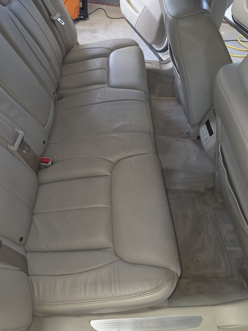 Rear leather seating cleaned and conditioned on an older sedan, Hartford WI auto detailing