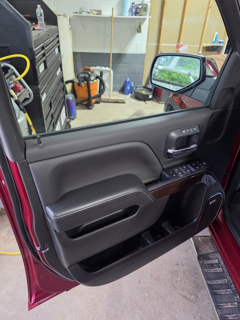 Driver door panel cleaned and conditioned during a Hartford, WI truck detail